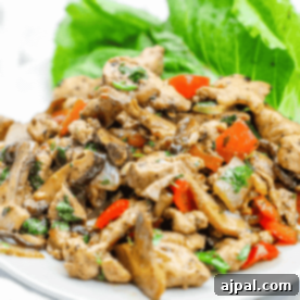 Diced pork lettuce cups on a white plate.
