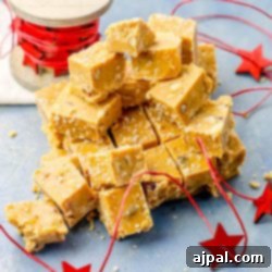 A small pile of easy slow cooker fudge with red and white stars on a blue background.