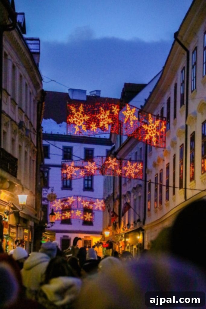 Festive Christmas lights illuminate a charming street in Bratislava, Slovakia
