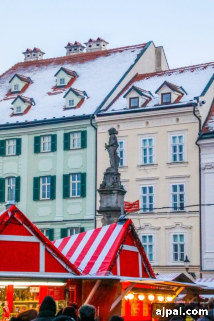 A festive Christmas market in Bratislava, Slovakia, with stalls, lights, and historical buildings
