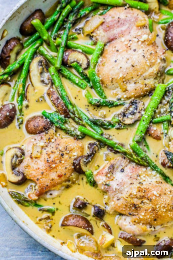 pan with chicken, asparagus, mushrooms, and creamy sauce