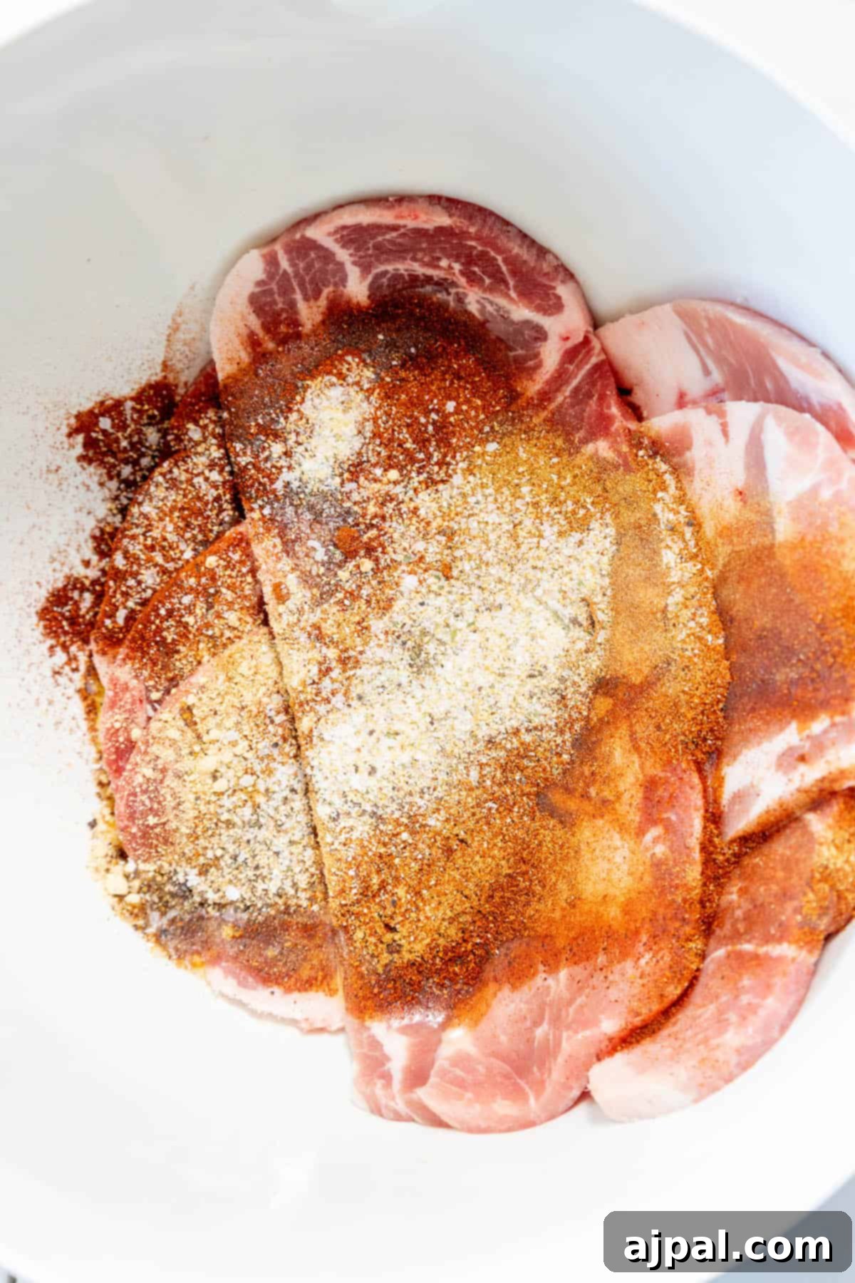 Fall-Apart Tender Crock Pot Pork Steaks 7 Tender pork steak, seasoned with salt and pepper, simmered in a slow cooker for maximum flavor.
