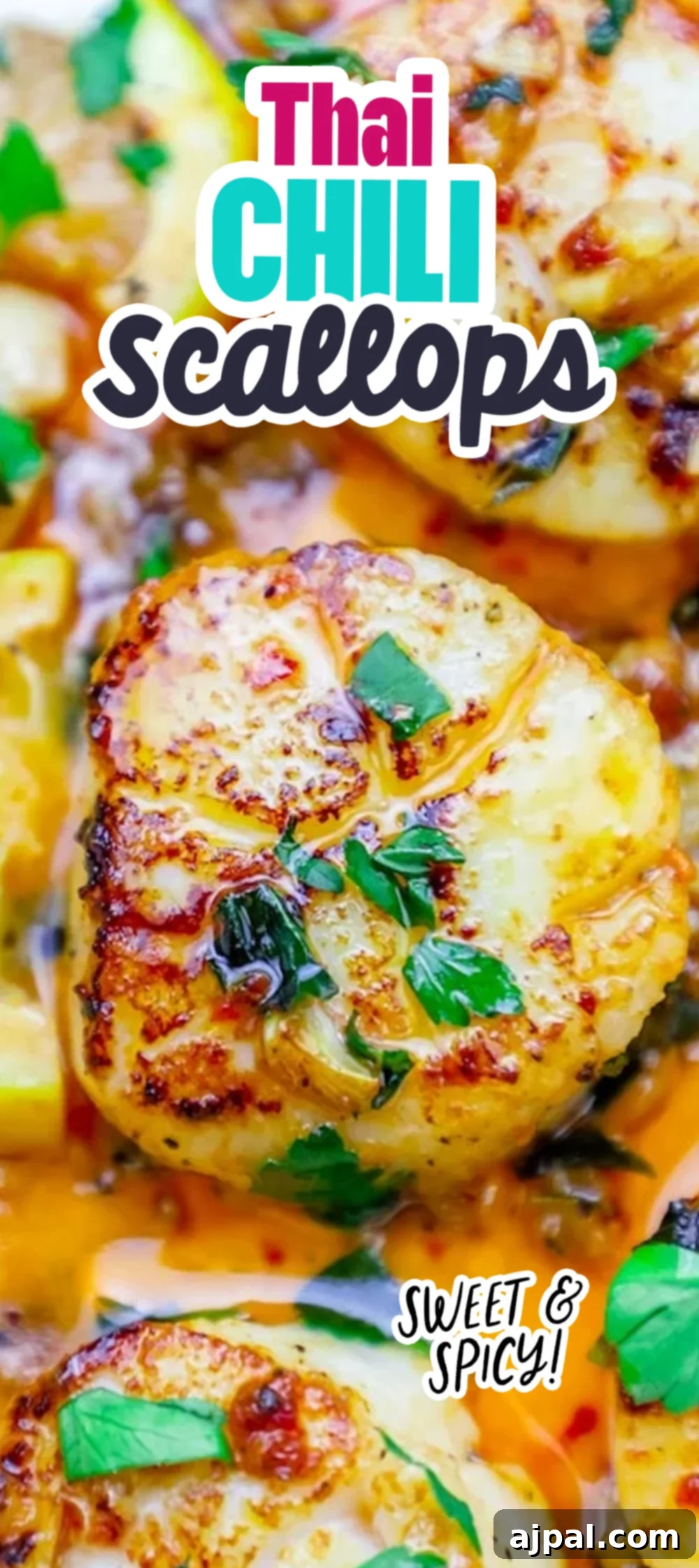 A single seared scallop in a pan, topped with cilantro and chili sauce, next to a lemon slice – a perfect representation of quick Thai chili scallops.