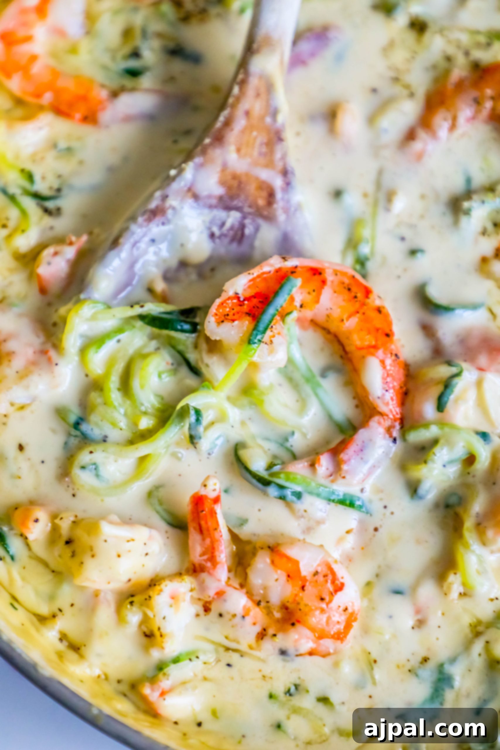 Velvet Shrimp Zoodle Alfredo 4 shrimp in a creamy sauce with noodles made out of zucchini