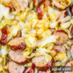 Saint Patrick's Day Cabbage Recipe: Delicious slow cooker dish with sausage and cabbage.