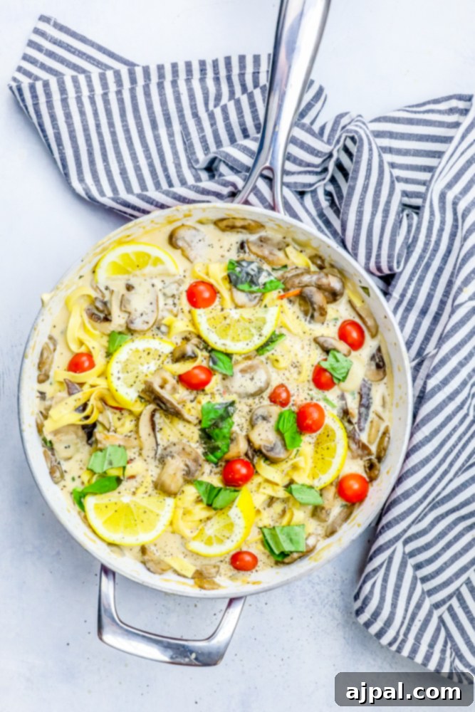 Silky One-Pot Tuscan Mushroom Linguine 6 A creamy, one-pot mushroom linguine recipe in a serving dish, garnished with fresh herbs.