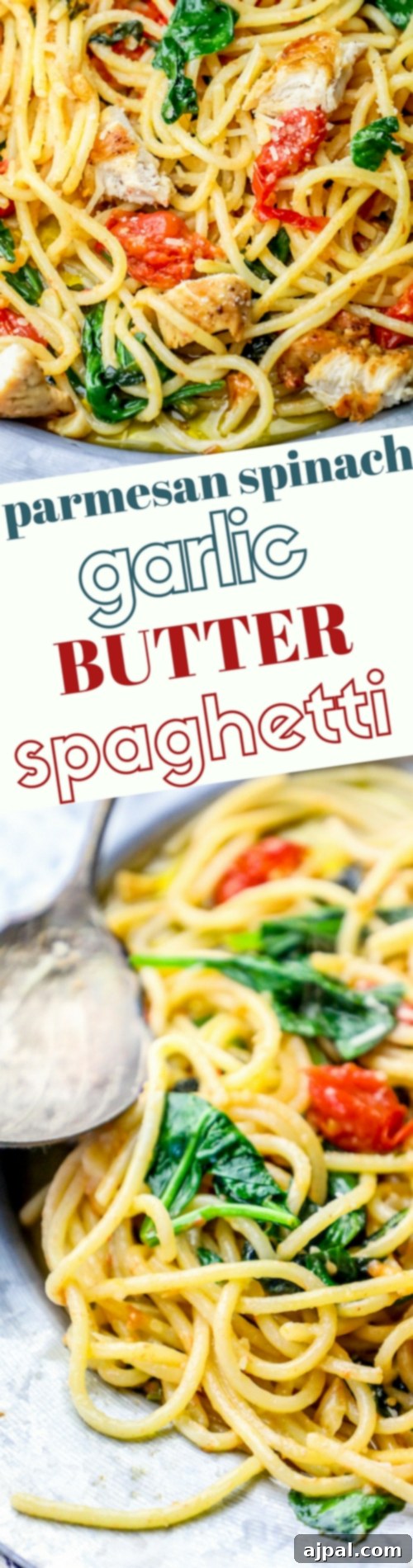 Garlic Butter Spinach Parmesan Spaghetti 7 A top-down shot of Spinach Parmesan Garlic Butter Spaghetti in a pan, with fresh Parmesan cheese being sprinkled over it.