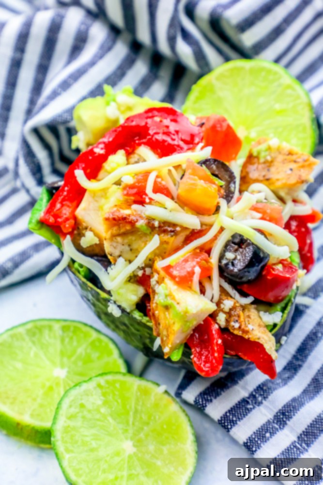 Loaded Cheesy Chicken Taco Salad Avocado Boats 4 avocado with chicken, olives, cheese in it