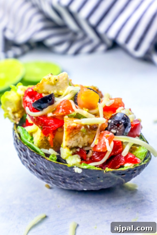 Loaded Cheesy Chicken Taco Salad Avocado Boats 5 Keto cheesy chicken taco stuffed avocados.