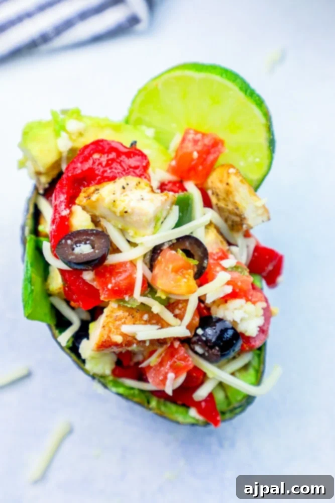 Loaded Cheesy Chicken Taco Salad Avocado Boats 6 A keto chicken taco avocado stuffed with peppers and olives.