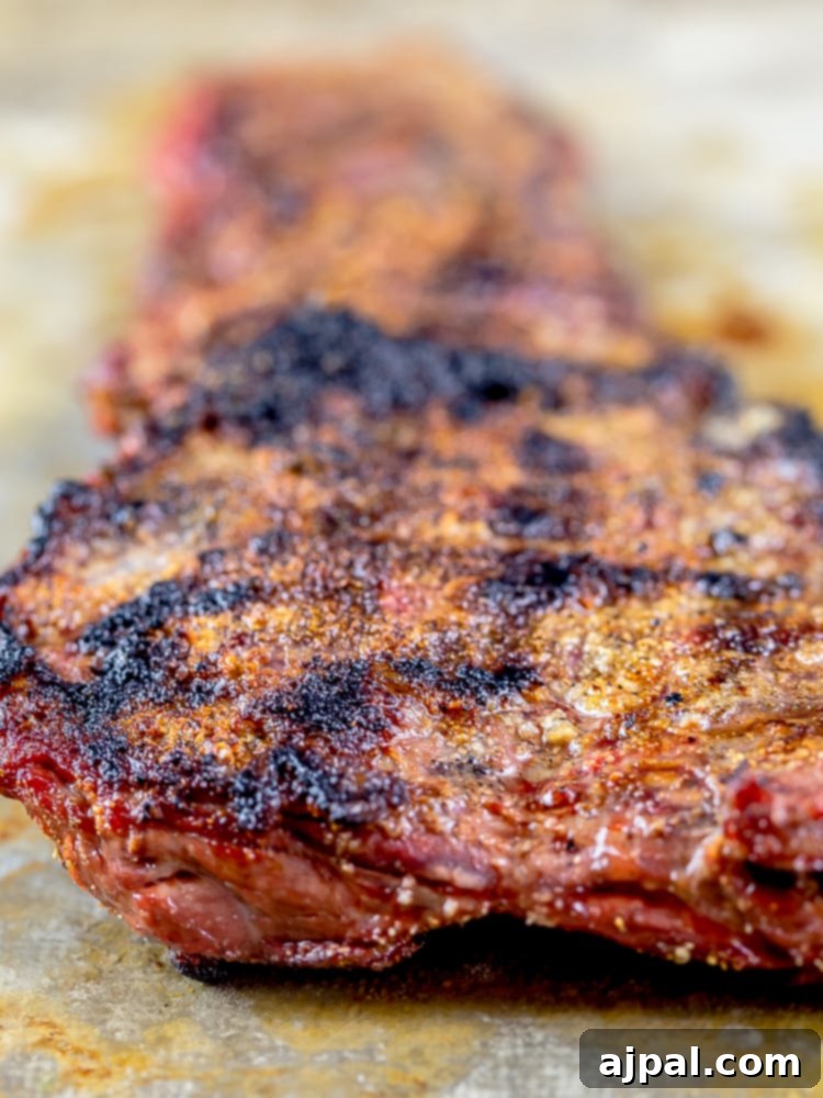 Mastering Grilled Flank Steak 4 Grilled skirt steak on a baking sheet, ready to be served.