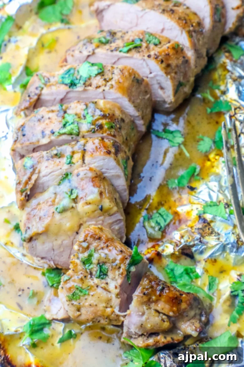 Simple Baked Ranch Pork Tenderloin with Gravy 7 Close-up of pork tenderloin in creamy ranch gravy foil pouch.