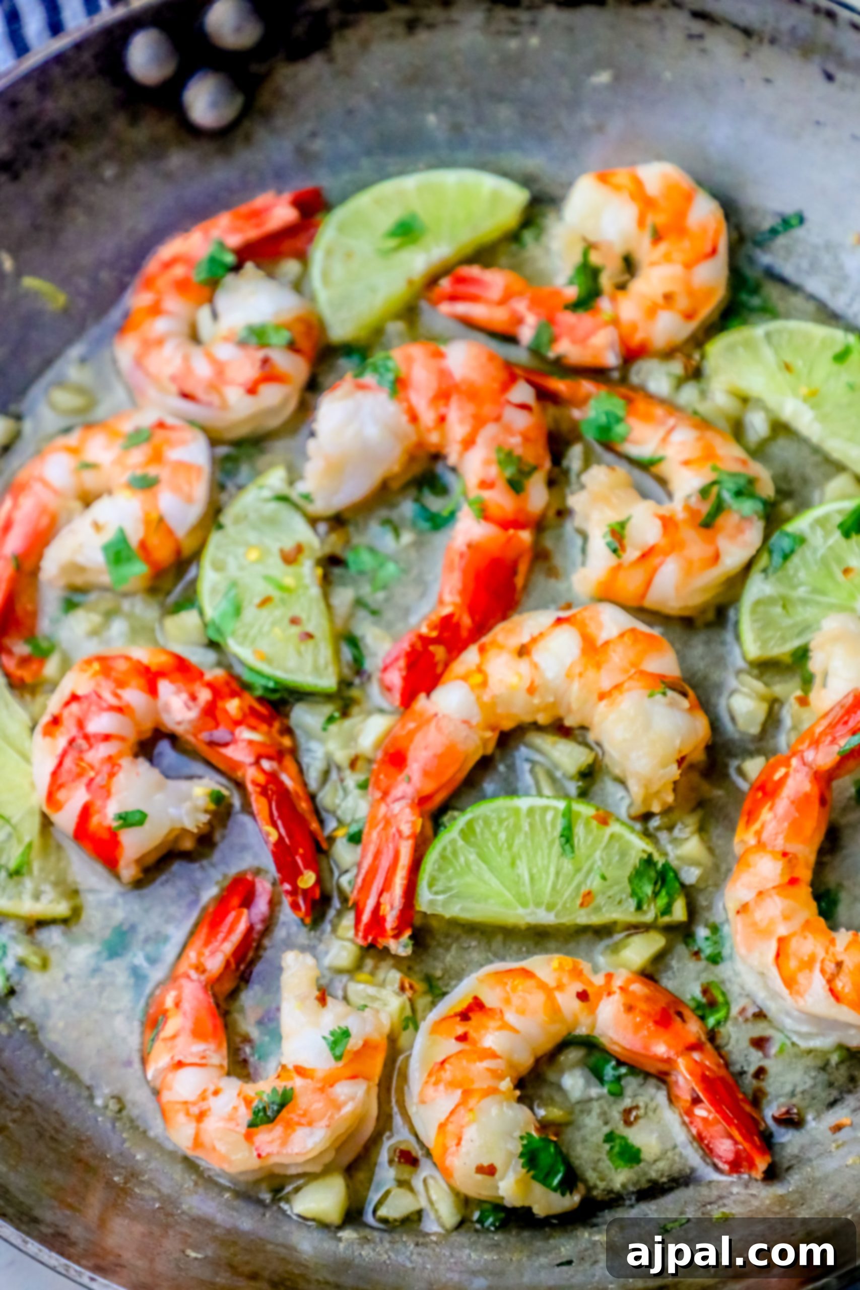 Effortless Cilantro Lime Shrimp 2 shrimp, limes, and cilantro in a pan