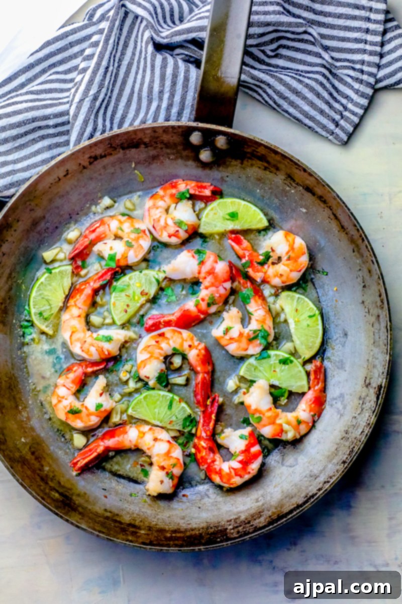 Effortless Cilantro Lime Shrimp 3 shrimp, limes, and cilantro in a pan