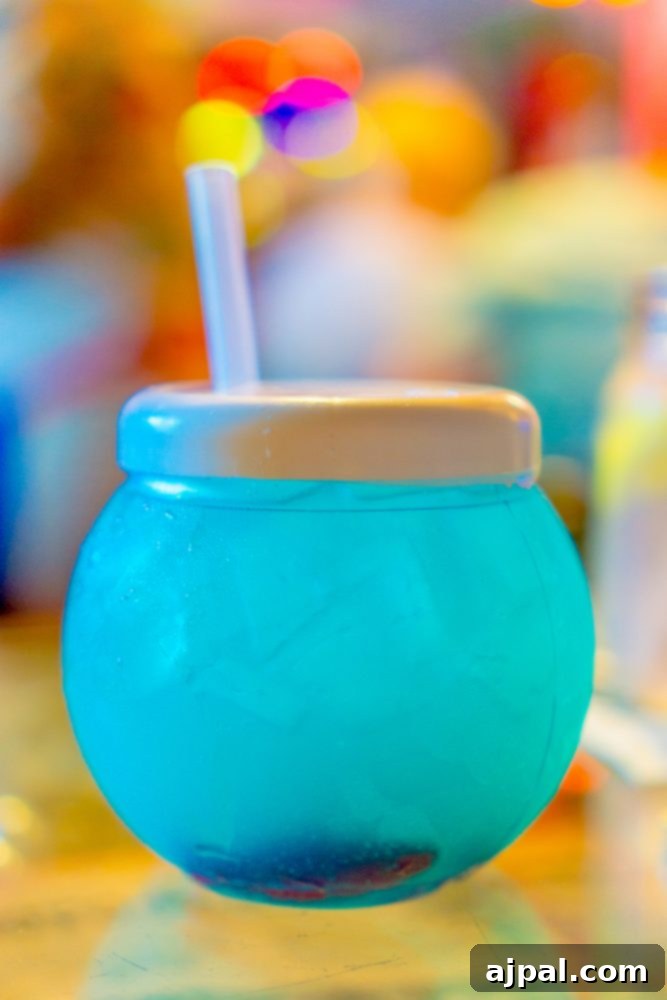 Savor Sanibel: A Culinary Journey 19 A refreshing blue beverage with a straw, perfect for dining in Sanibel Island, Florida.