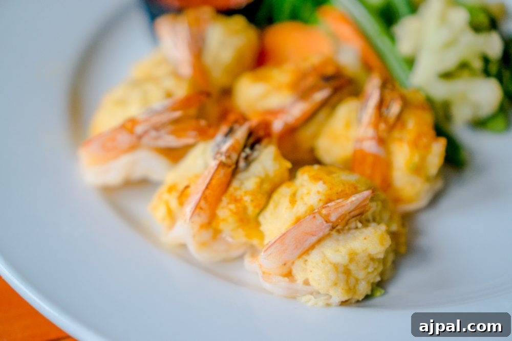 Savor Sanibel: A Culinary Journey 33 A plate of dinner with shrimp and vegetables on it in Sanibel Island, Florida.