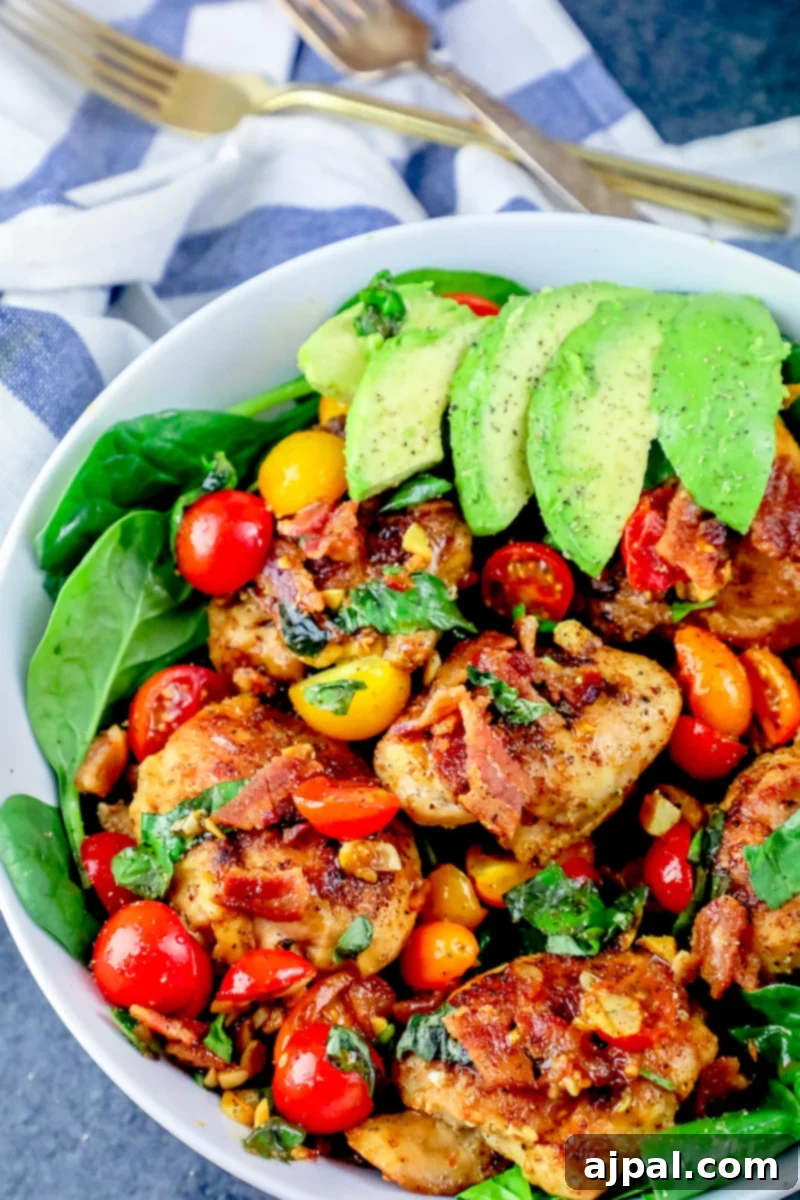 Ultimate B.L.A.T Chicken Thigh Salad 2 A picture of bacon, lettuce, avocado, tomato chicken thigh salad on a bowl