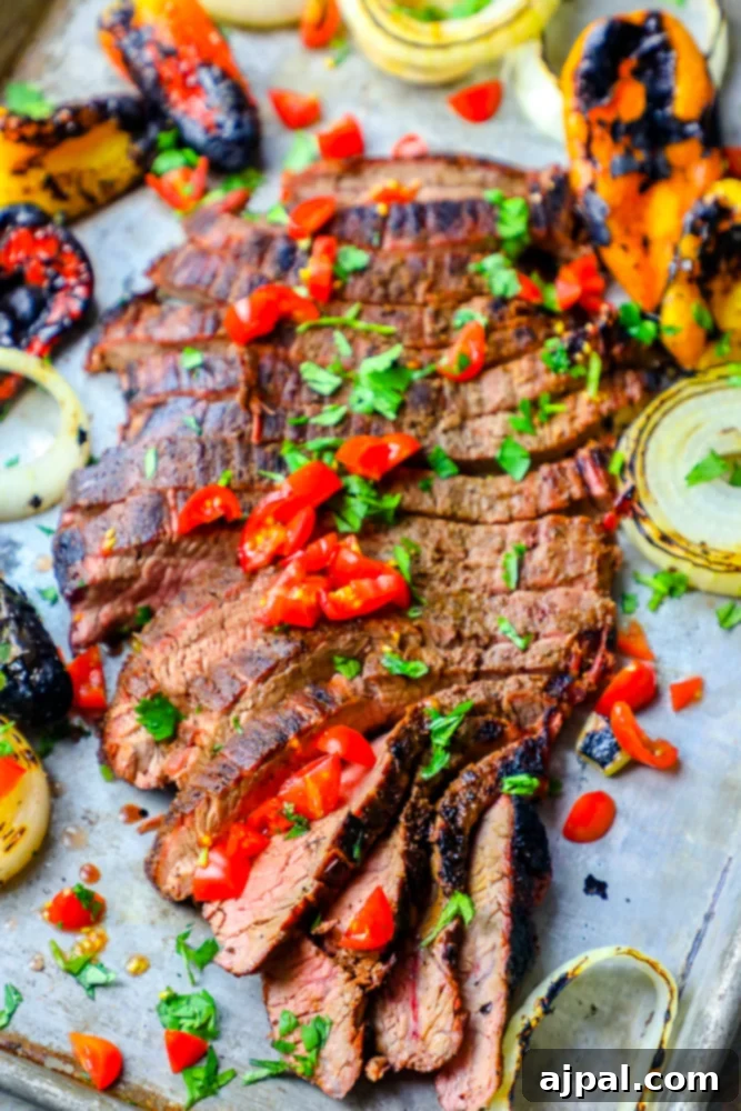 Ultimate Carne Asada 4 Delicious grilled steak with a medley of colorful vegetables, showcasing an easy and the best carne asada recipe perfect for making fajitas.