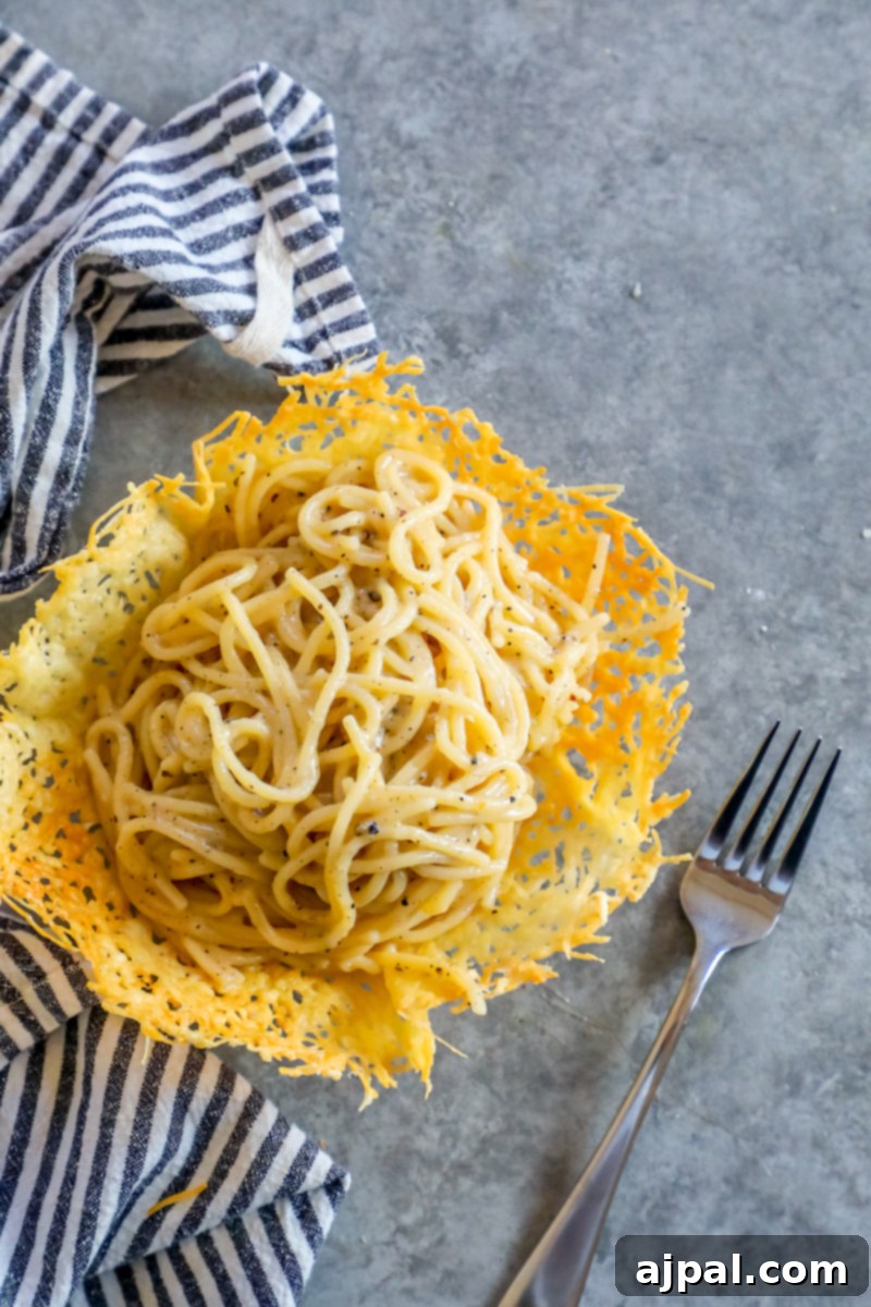 The best Cacio e Pepe recipe ever, featuring simple spaghetti with cheese and pepper, authentically prepared and served in a charming basket with a fork.