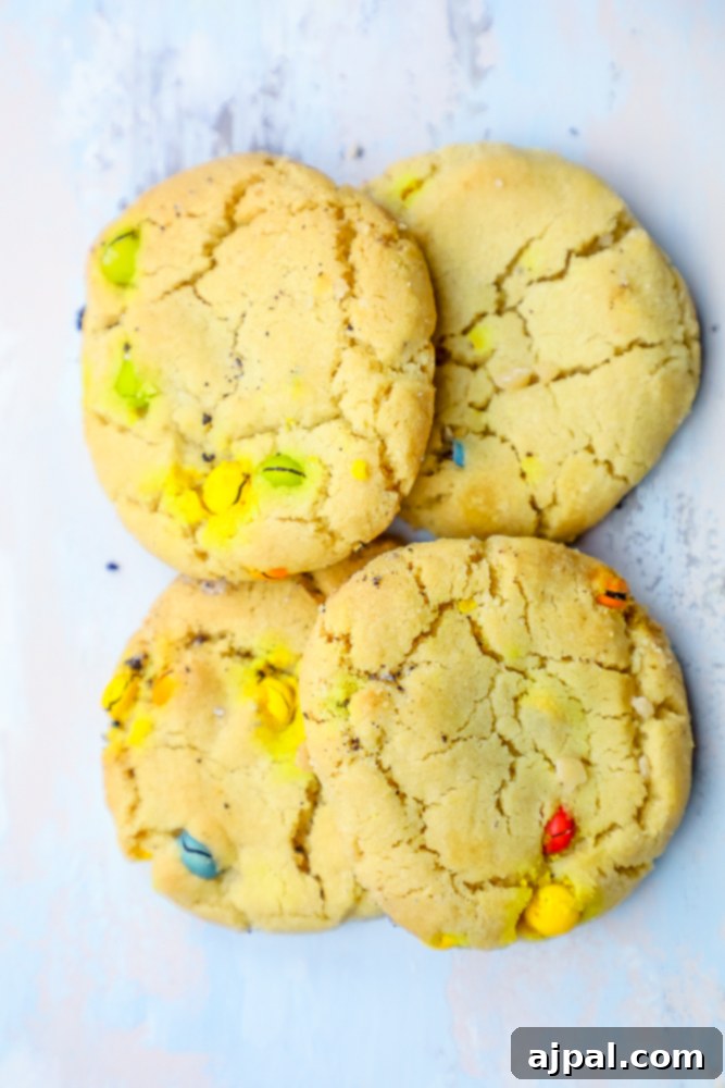 Chewy M&M cookies on a blue background.