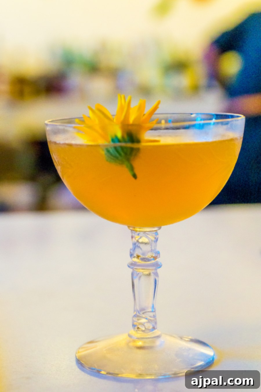 A cocktail with a flower in it served at a restaurant in Kansas City, Missouri.