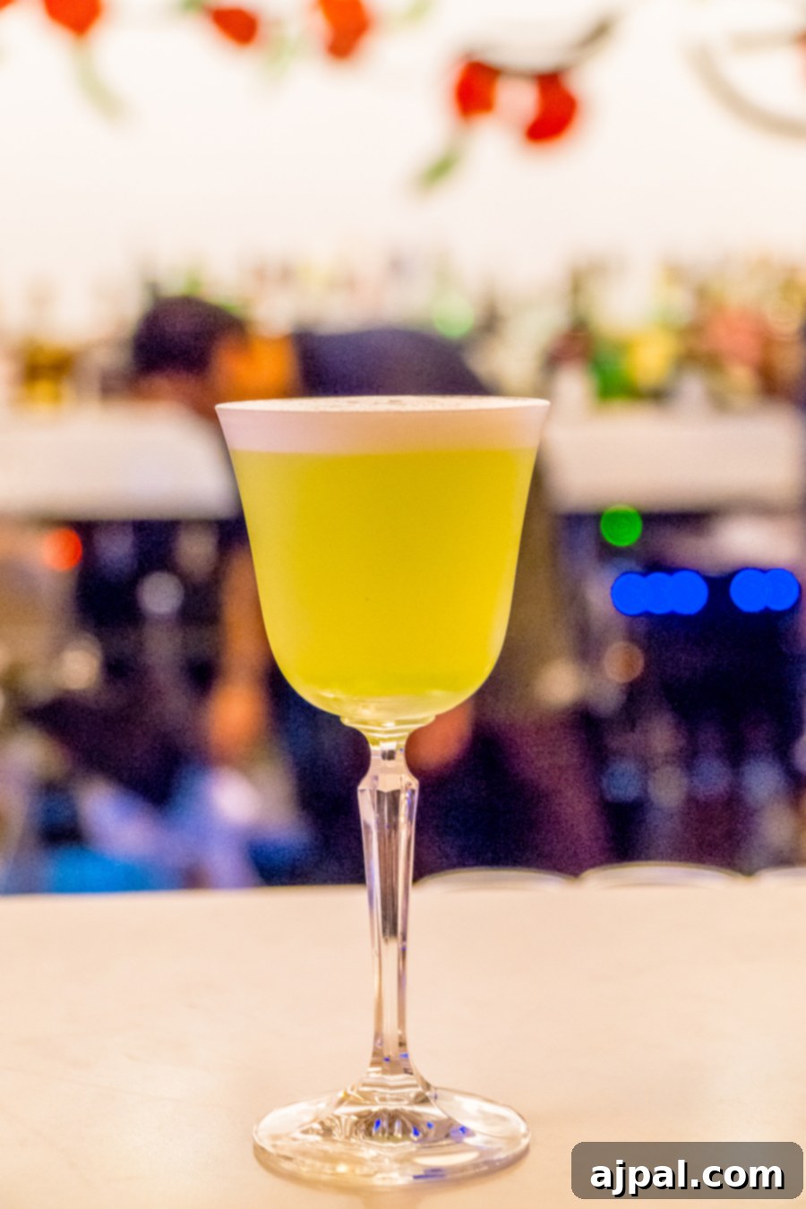 A green drink in a glass on a bar in Kansas City, Missouri.