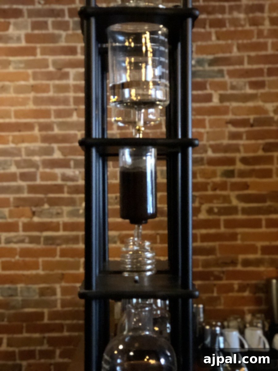 A coffee brewer perched atop a brick wall in Kansas City.
