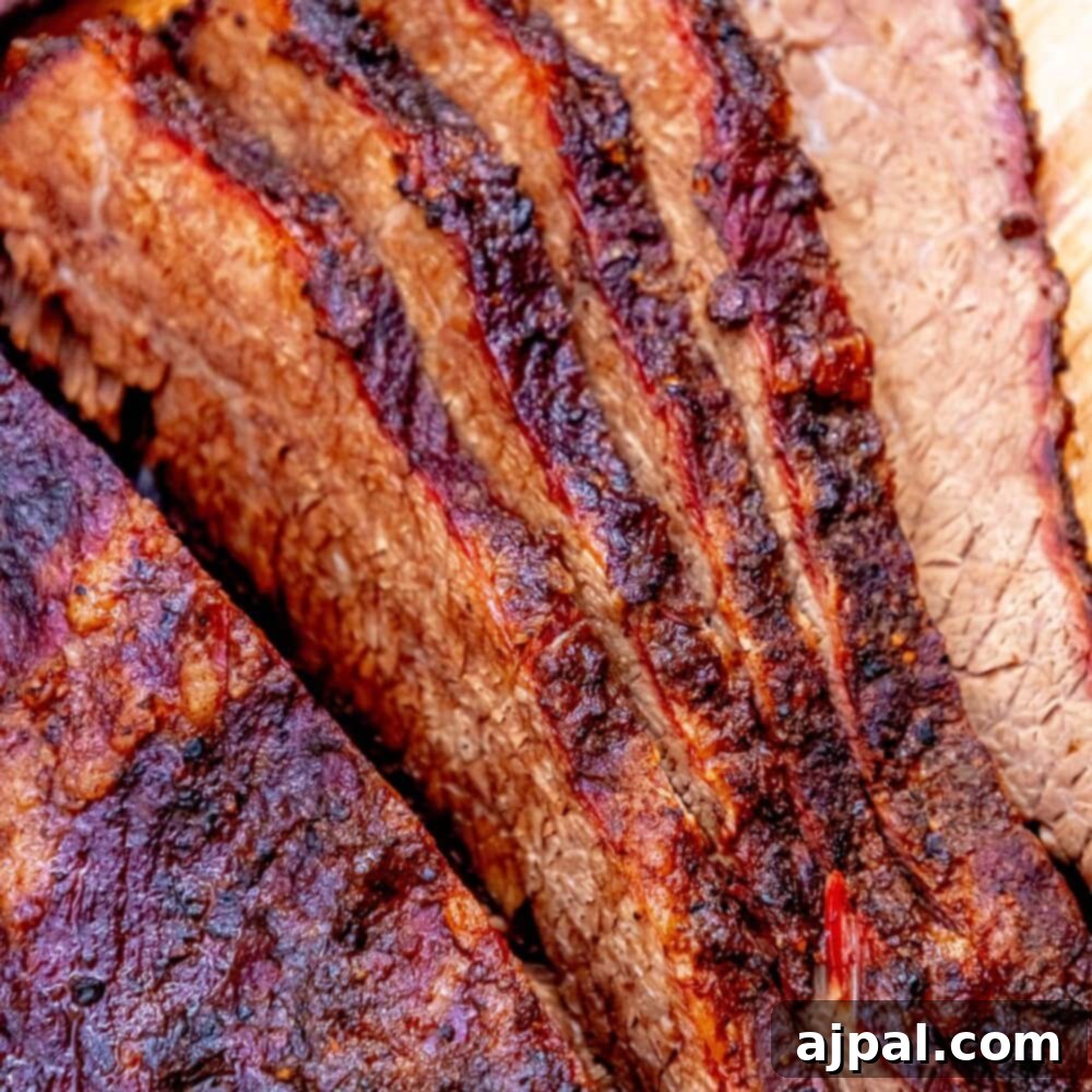 Expertly sliced smoked brisket, revealing its juicy interior and perfect smoke ring, ready to be served.