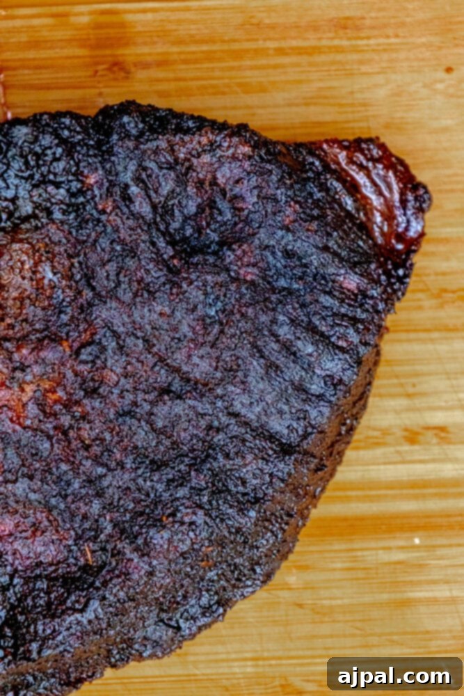 A delicious piece of smoked meat prepared with an easy recipe, presented with vibrant garnishes.