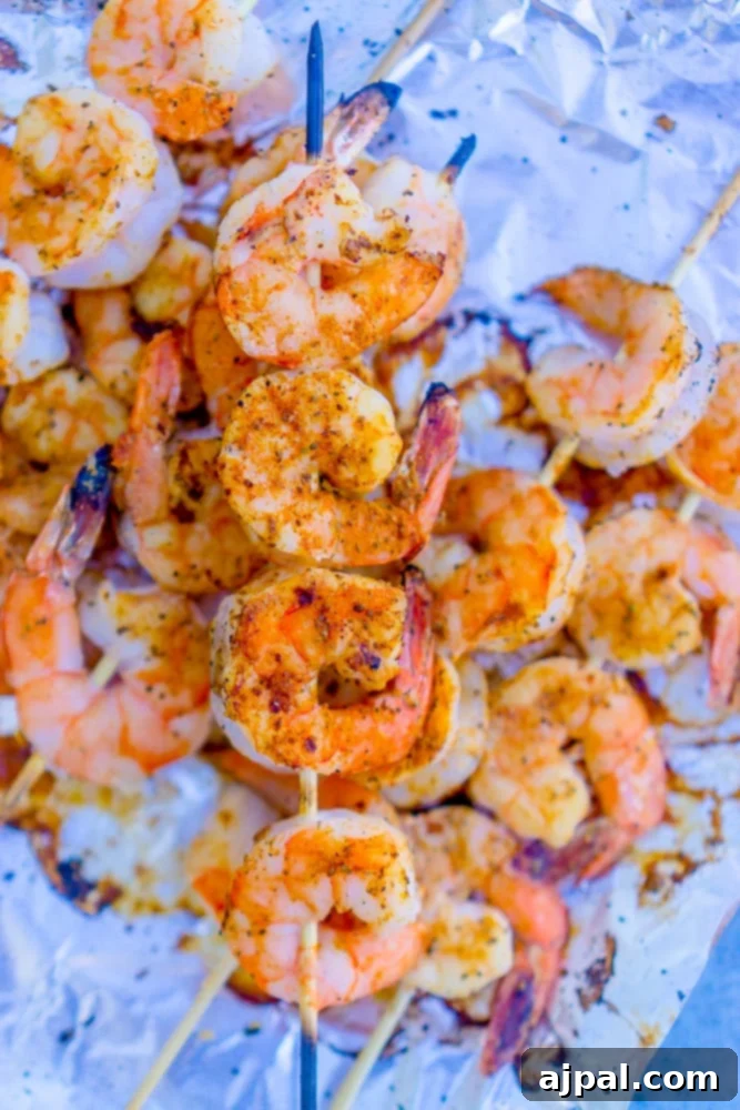 Quick Blackened Shrimp Skewers 2 Shrimp on a stick with spices, sizzling on the grill