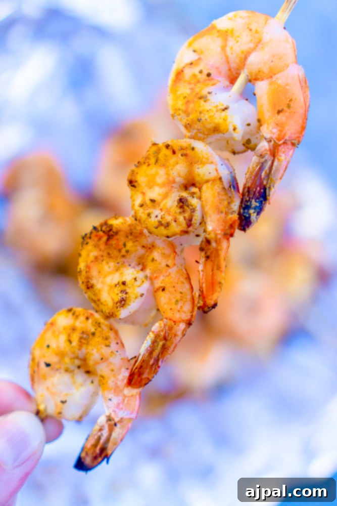 Quick Blackened Shrimp Skewers 3 Juicy shrimp kebabs seasoned with blackening spices, ready to be grilled.