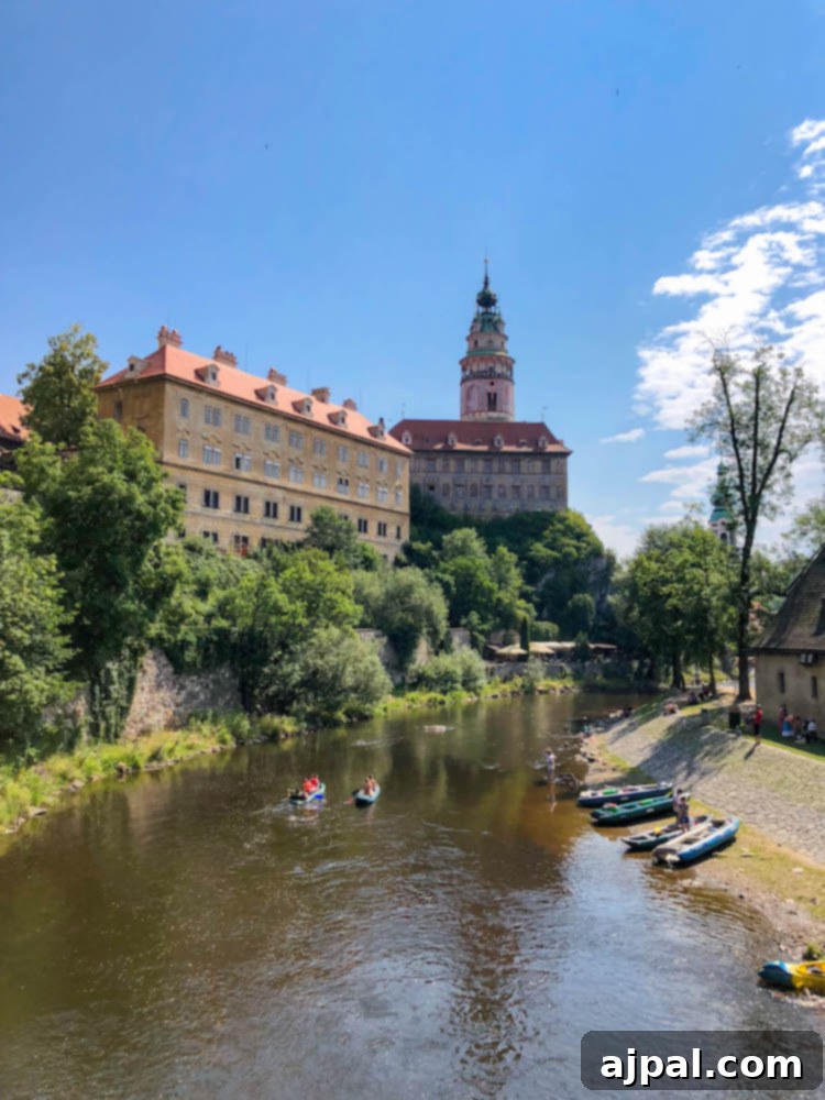 Kayakers enjoying a leisurely ride on the Vltava River, which gracefully winds through the historic buildings of Cesky Krumlov, a popular activity in this scenic town.