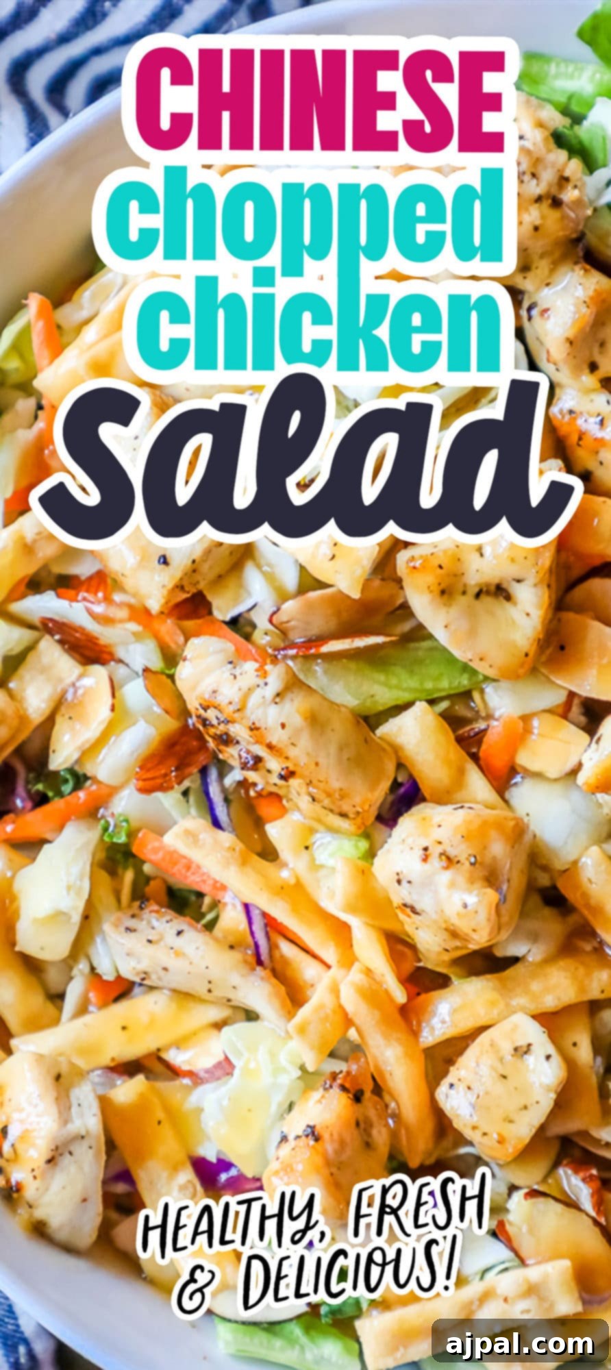 A close-up of a delicious Chinese chopped chicken salad, brimming with flavor and texture, served in a white bowl.