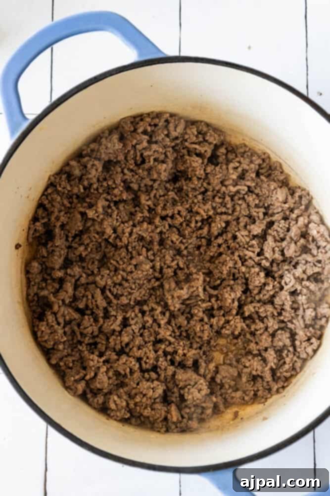Ground beef on a wooden table.