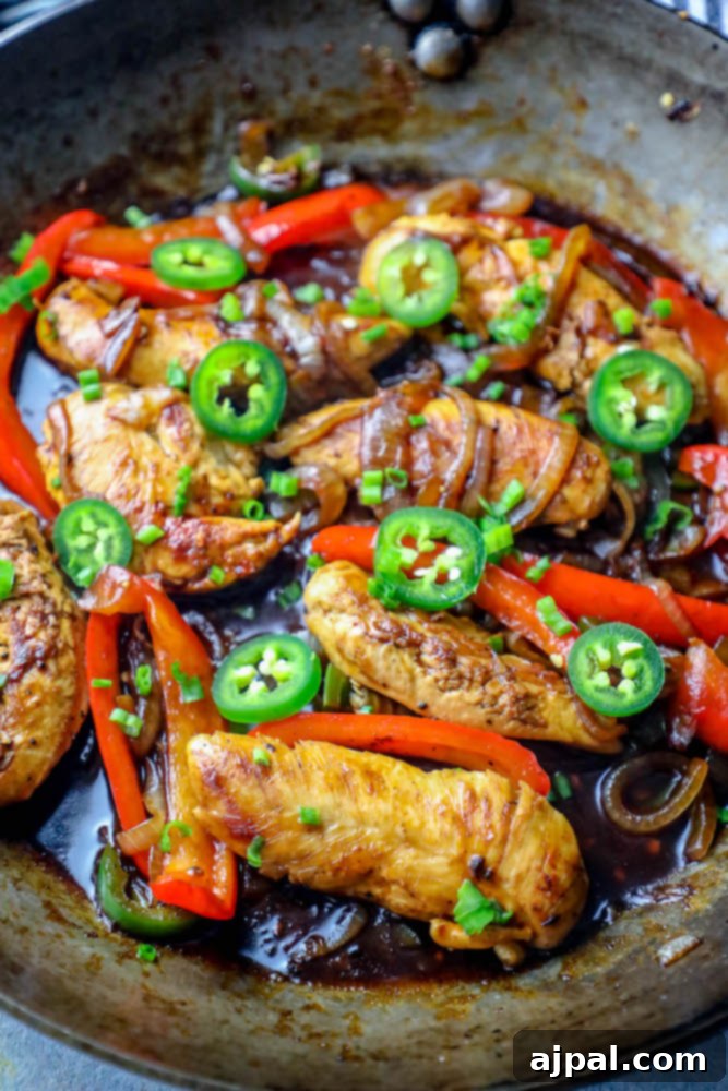 chicken, onions, peppers, and jalapenos in a pot together