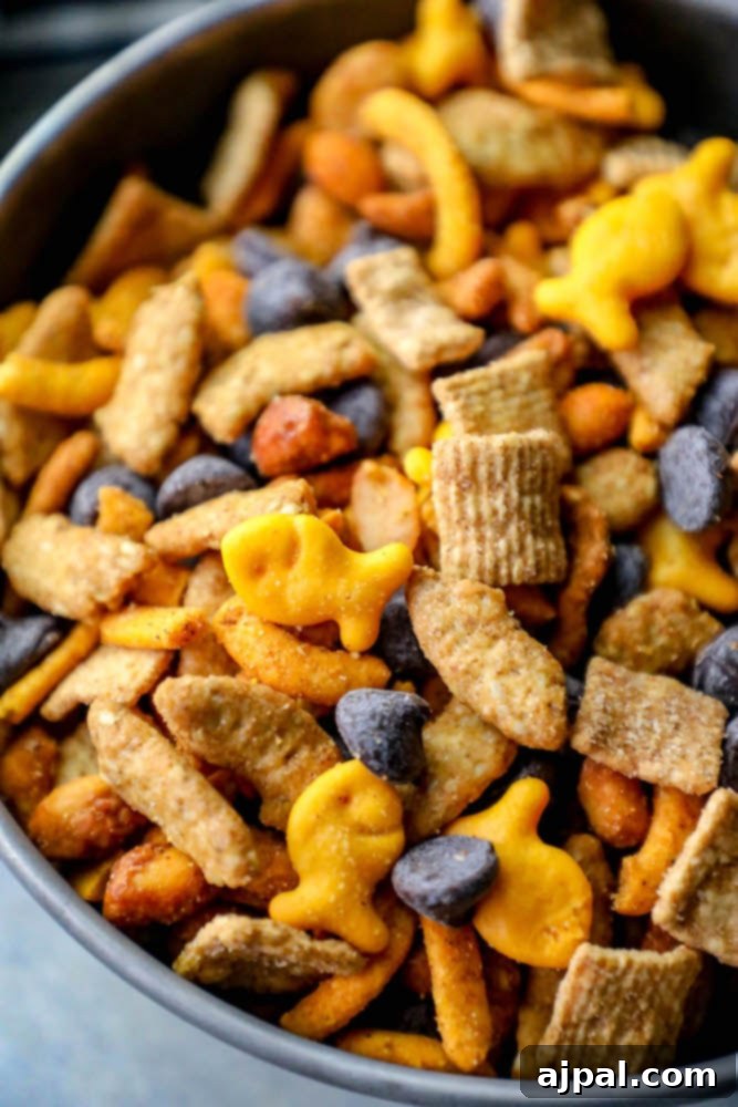 A freshly prepared bowl of homemade snack mix sits atop a stove, ready to be enjoyed as a delightful sweet and spicy treat.