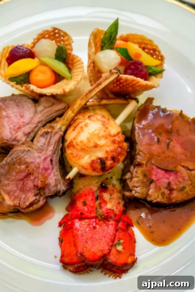 A beautifully presented plate of succulent surf and turf, featuring grilled lobster tail and steak, showcasing the gourmet dining options available on a Royal Princess Cruise.