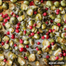 Easy Roasted Brussels Sprouts with Cranberries Recipe on a baking sheet.