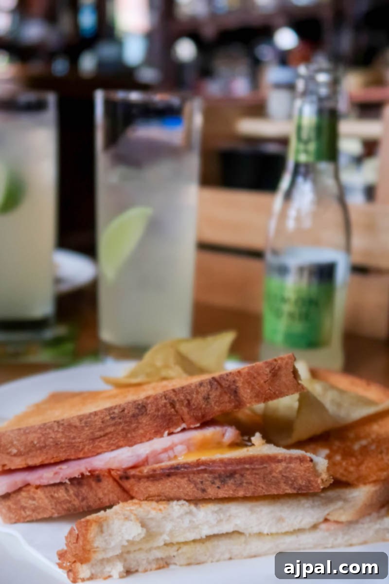 Delicious toasted ham and cheese sandwich with a pint in a Dublin pub