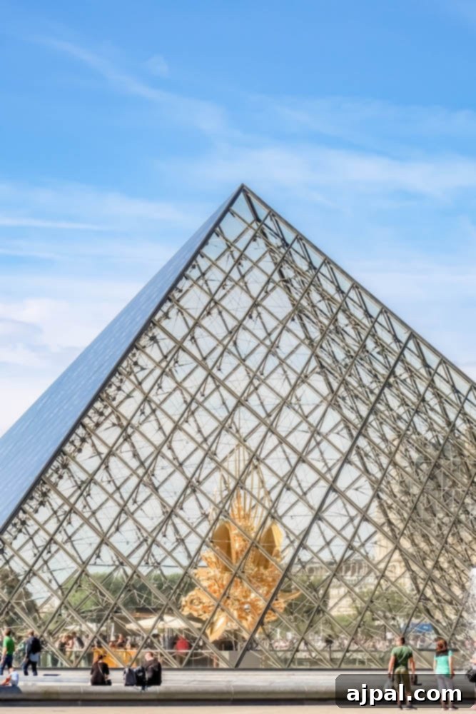 The iconic pyramid at the Louvre Museum in Paris, France.