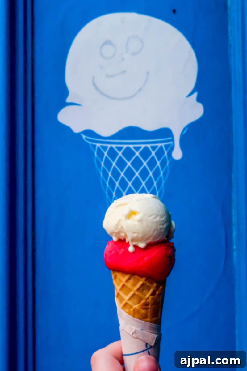 Book a British Isles Cruise: Your Adventure Awaits 12 A hand holds a delicious ice cream cone in front of a blue door in Dublin, Ireland.