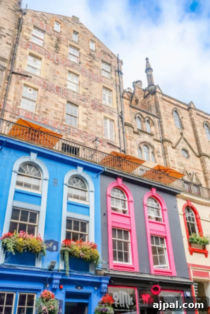 A picturesque street in Edinburgh, Scotland, with historic buildings and charming architecture, inviting exploration during a British Isles Cruise.