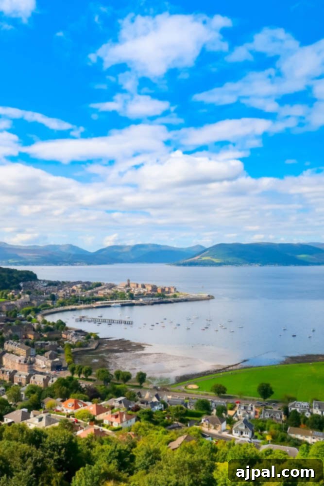 A scenic view of the lush, green landscapes of Greenock, Scotland, as seen from a British Isles Cruise.
