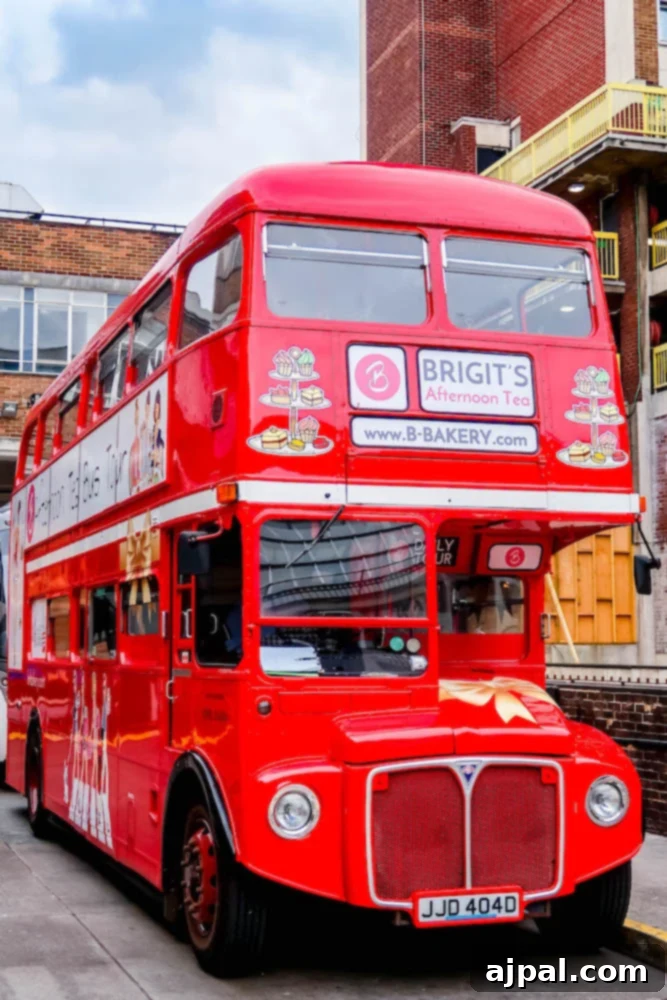 A classic red double-decker bus, an iconic sight in London, perfect for sightseeing during a British Isles Cruise.