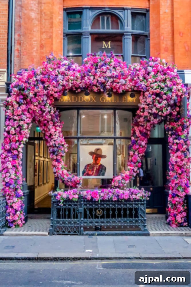 Book a British Isles Cruise: Your Adventure Awaits 9 A charming London art gallery with a beautiful pink floral arrangement adorning its entrance.