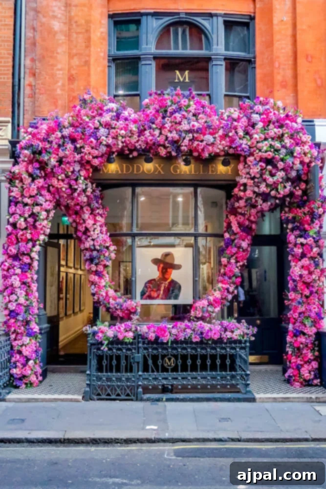 A charming art gallery building in London, adorned with a beautiful pink flower arrangement, a delightful sight on a British Isles Cruise.