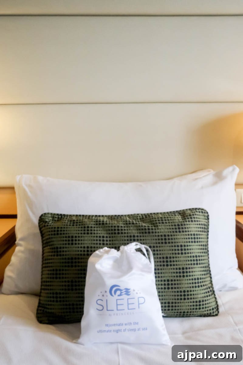 West Coast Majesty: A Royal Princess Voyage 5 A bed with a bag on it in the room of the Royal Princess Cruise ship.