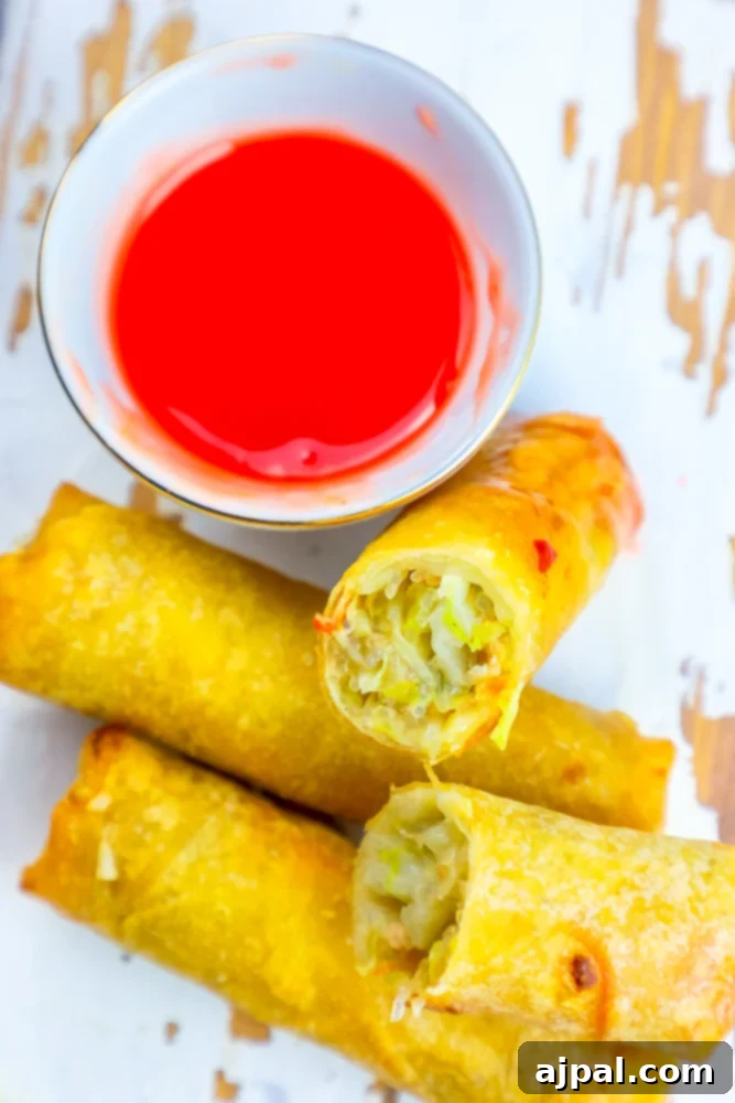 Crispy Homemade Egg Rolls 2 A vibrant plate of golden brown homemade egg rolls, perfectly fried and ready to be served, showcasing their crispy texture.