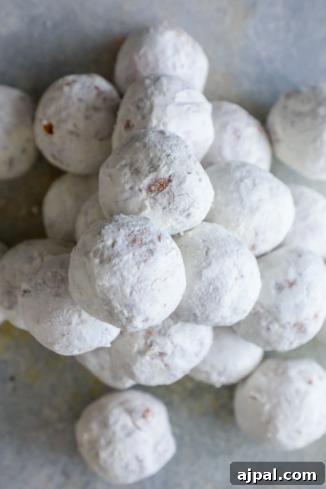 Effortless Powdered Doughnut Delights 2 pile of powdered sugar donut holes