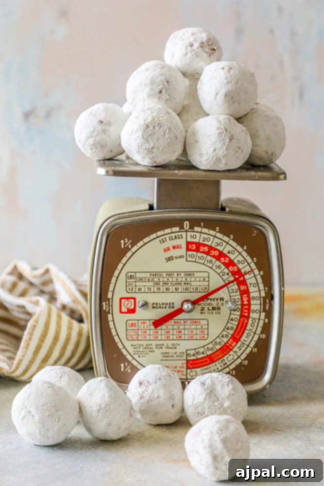 Effortless Powdered Doughnut Delights 5 powdered sugar donut holes on a home scale